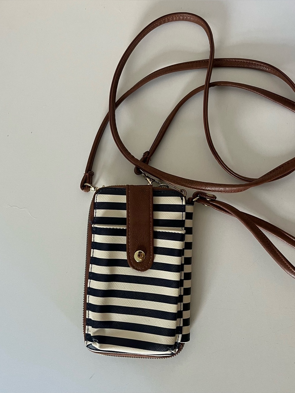 Navy and white striped crossbody bag with wrist strap
